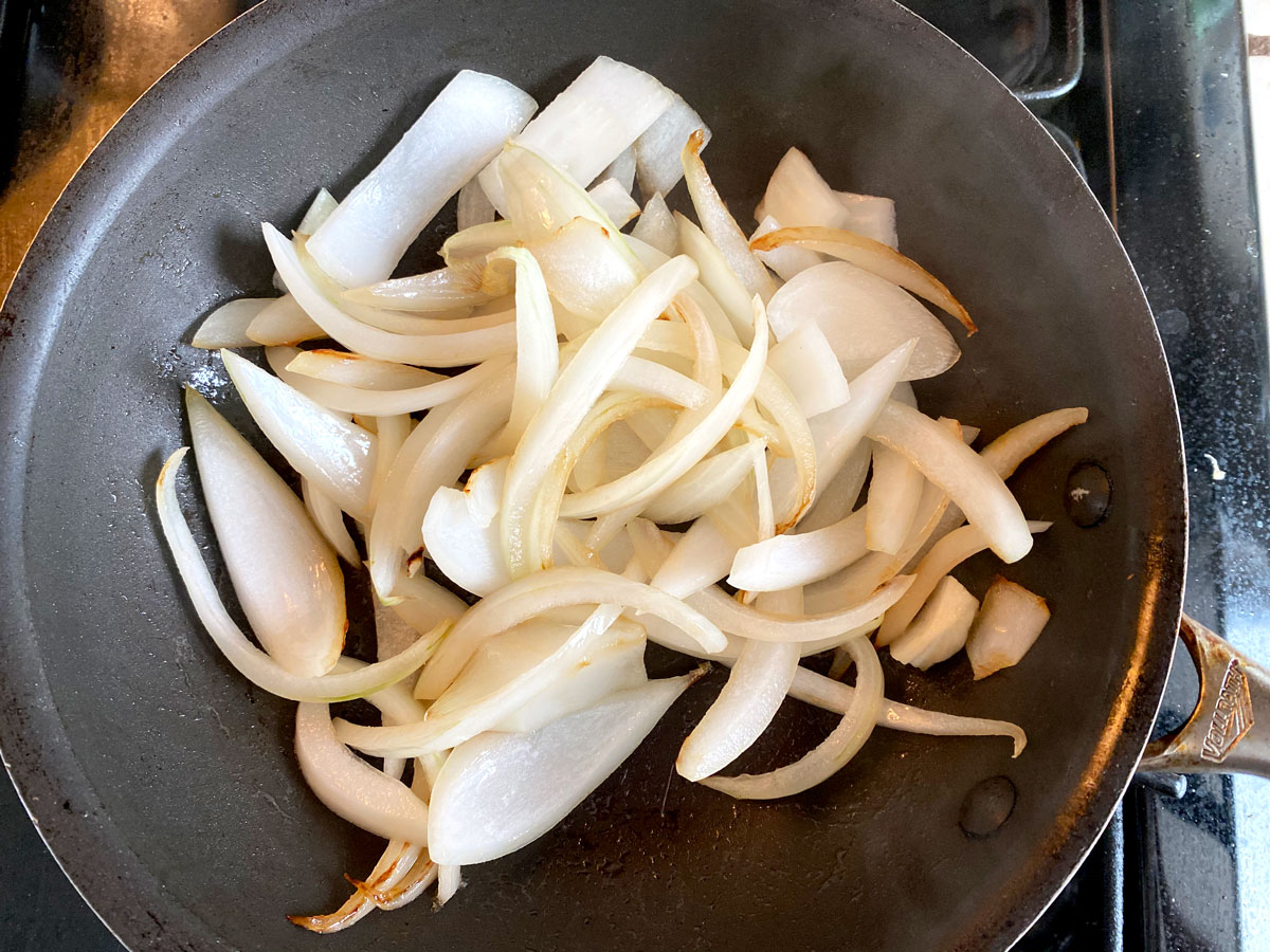 sliced onions in pan