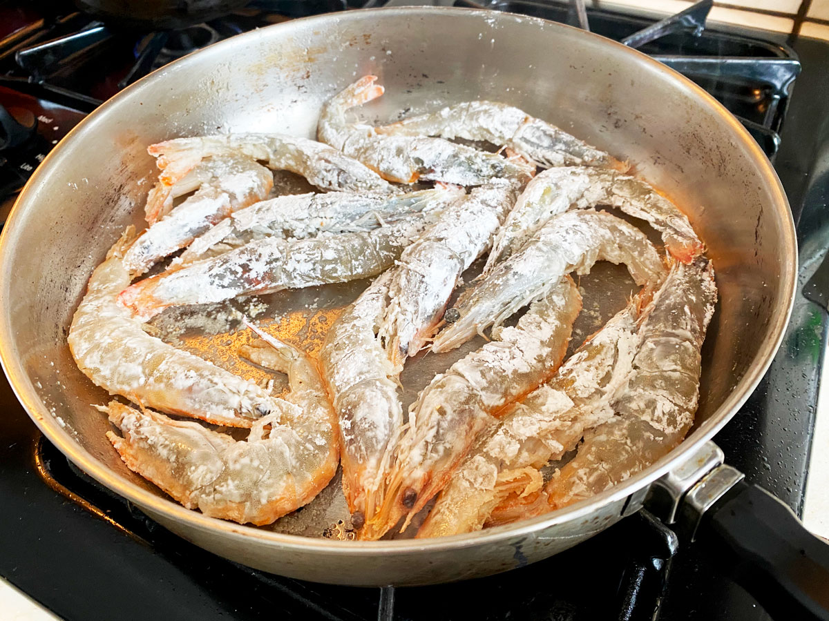 shrimp fried in a pan with cornstarch