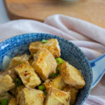 salt and pepper tofu in blue bowl