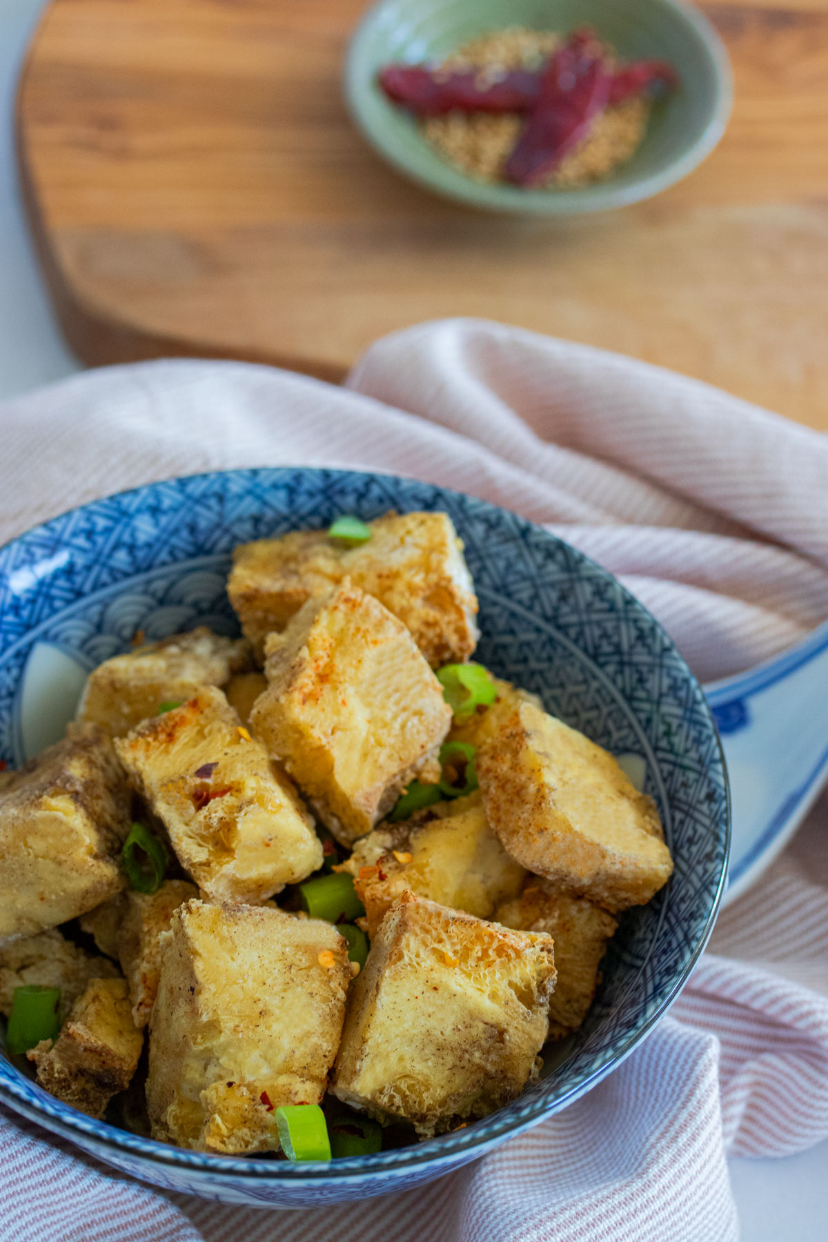 salt and pepper tofu in blue bowl