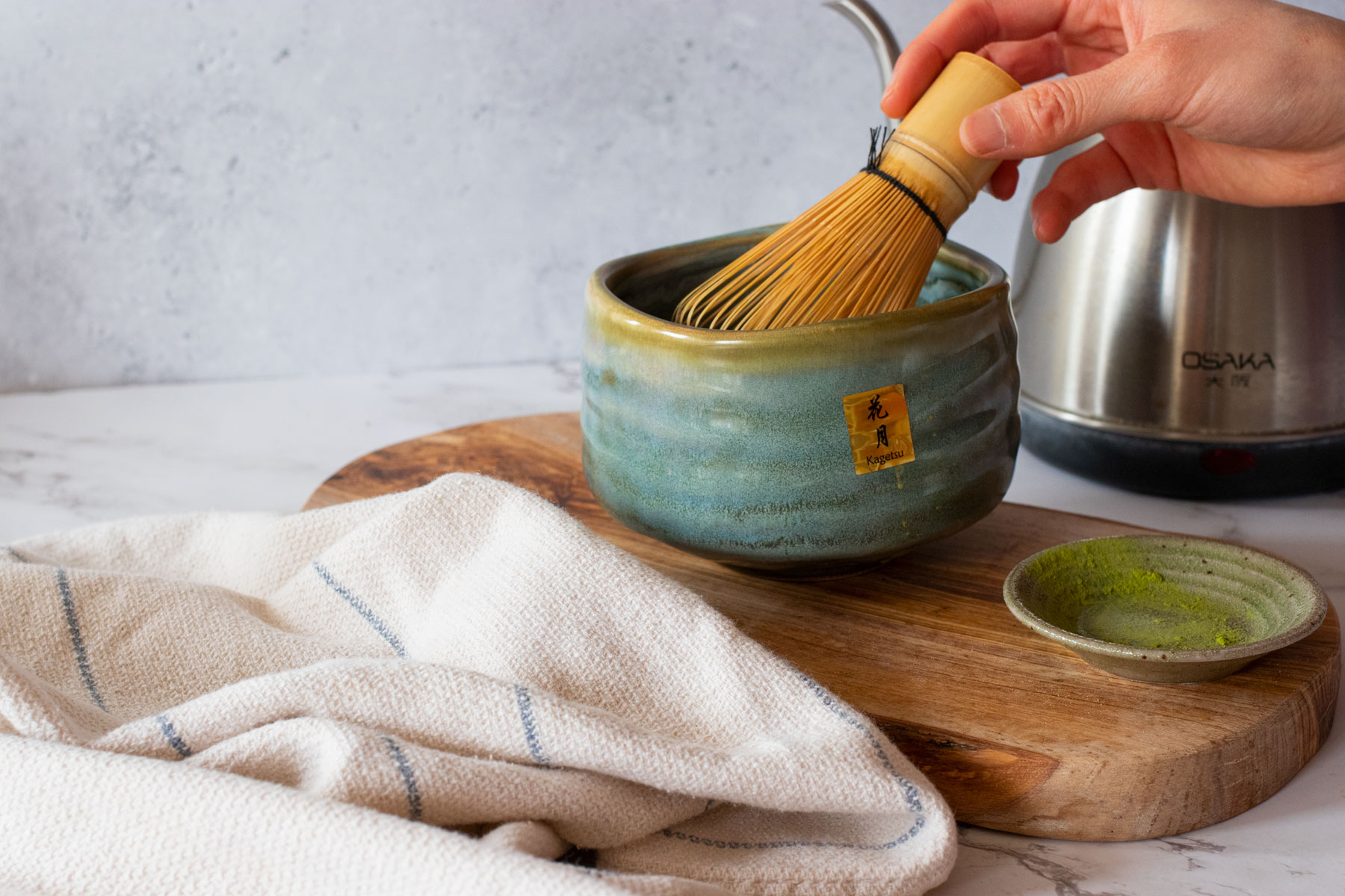 whisking matcha