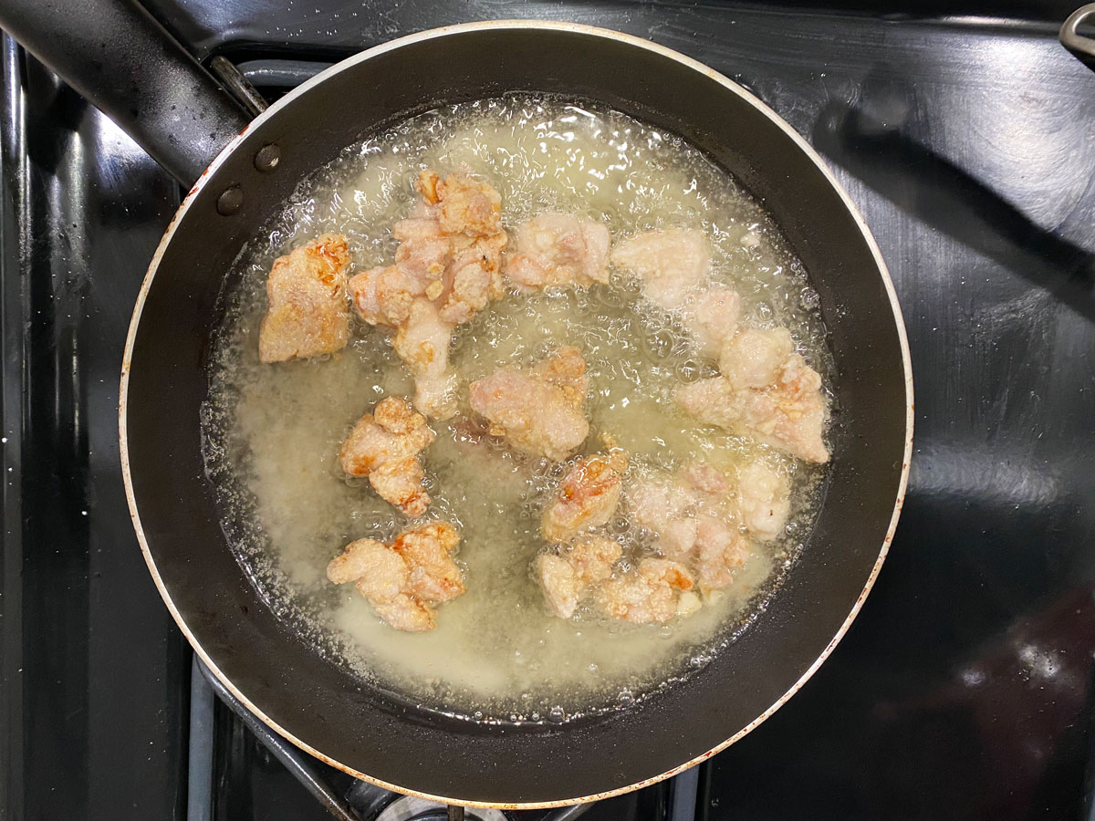 chicken frying in oil