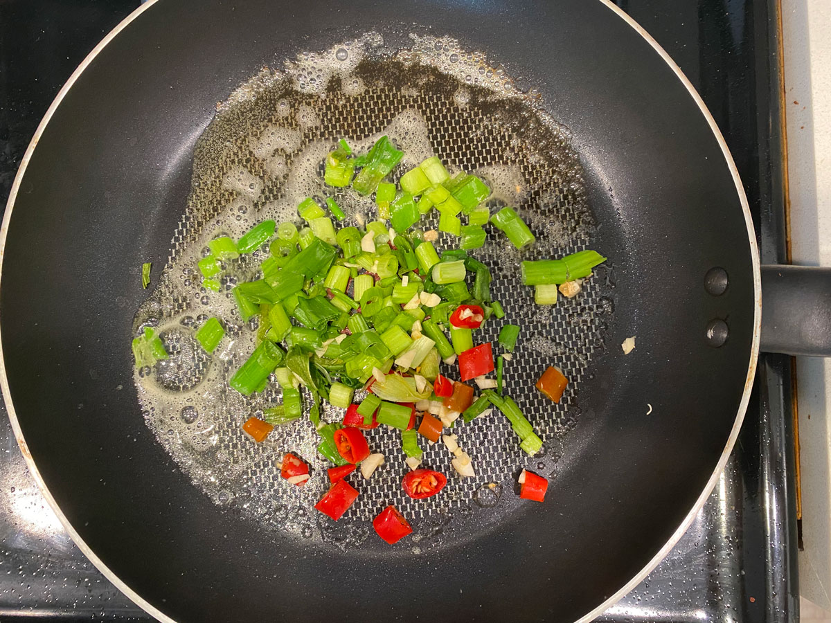 green onion, red chilies, minced garlic in butter