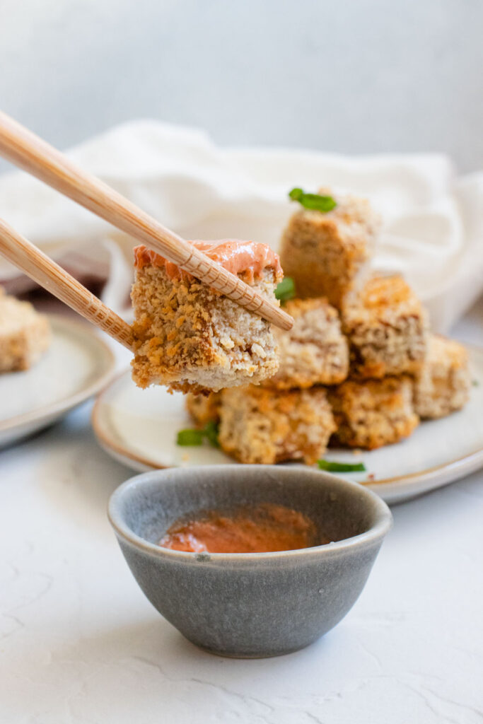 baked tofu nugget in dipping sauce