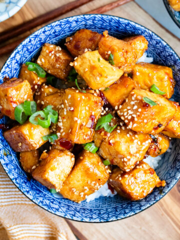 Honey sesame pan-fried tofu in a bowl.