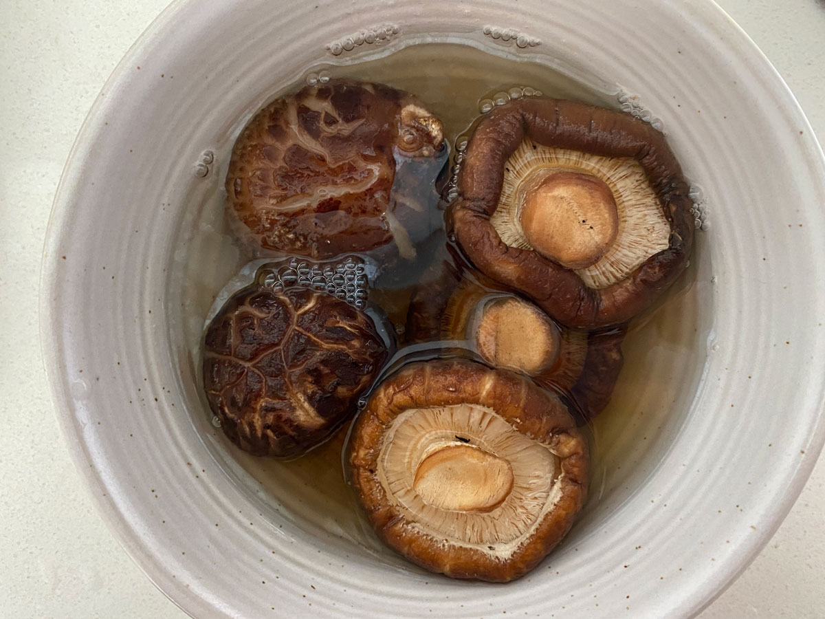 dried shiitake mushrooms soaking in water