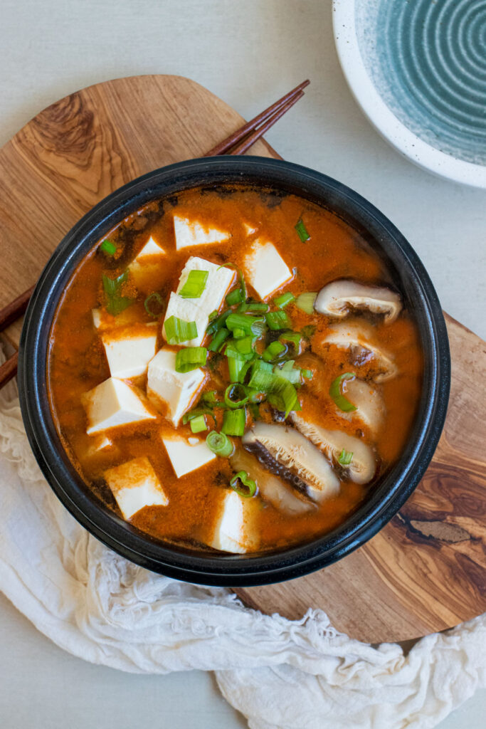kimchi mushroom soft tofu soup overhead shot