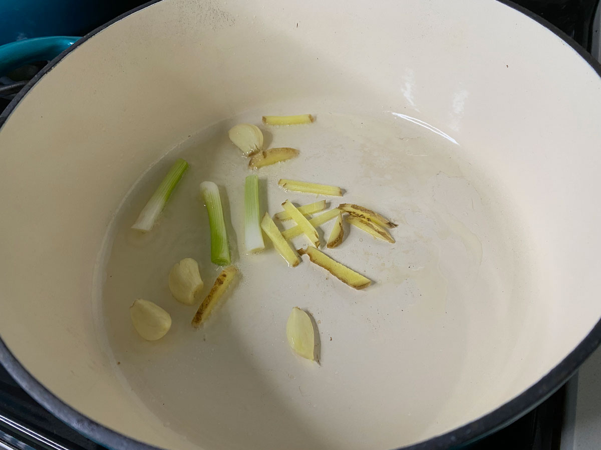 ginger, garlic, and scallions in pot