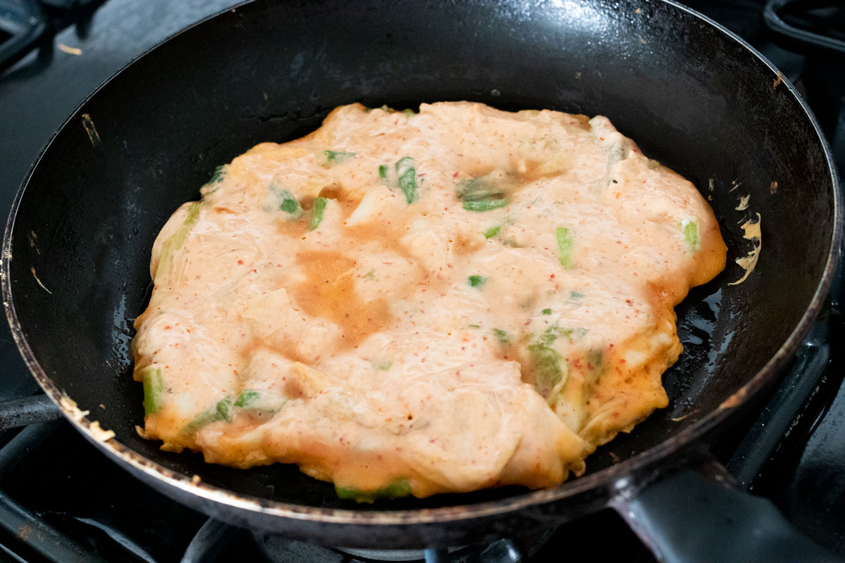 Kimchi pancake on pan.