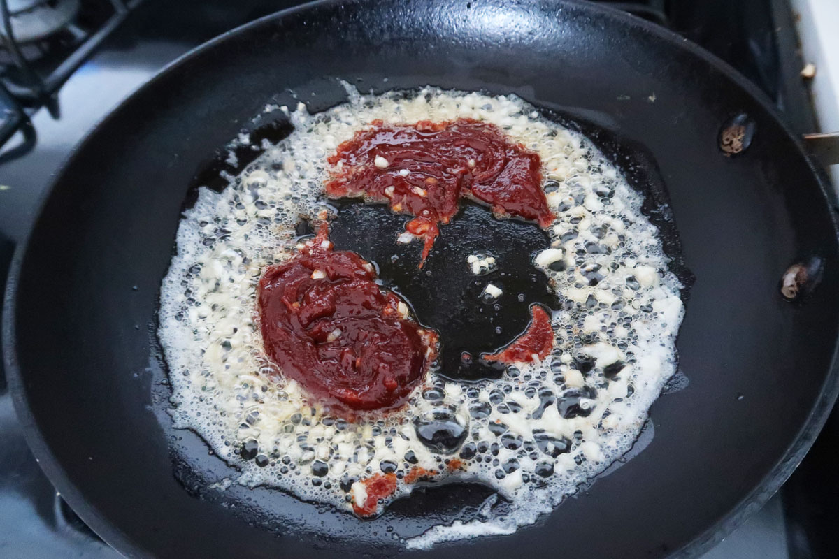 Cooking gochujang in butter with garlic. 