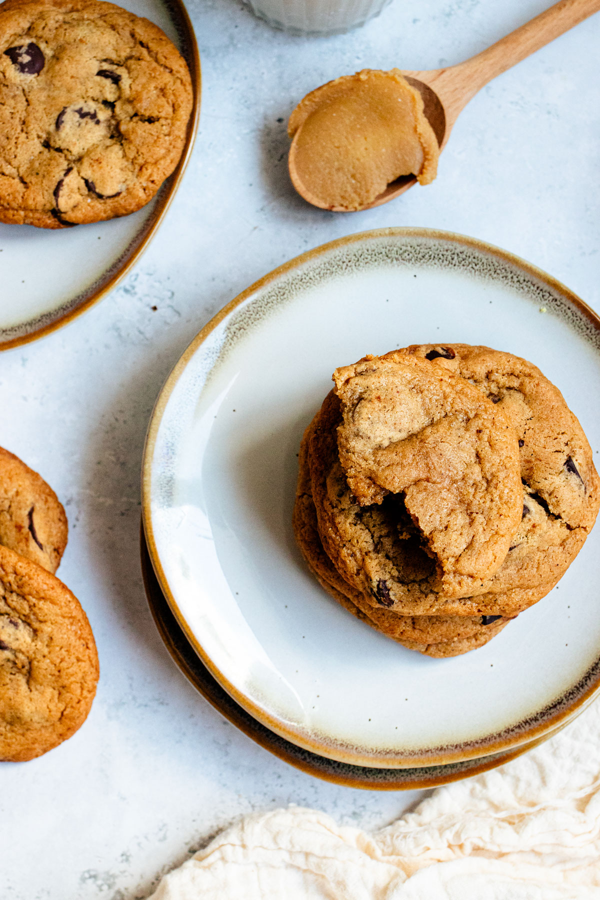 Half eaten miso chocolate chip cookie on a plate.