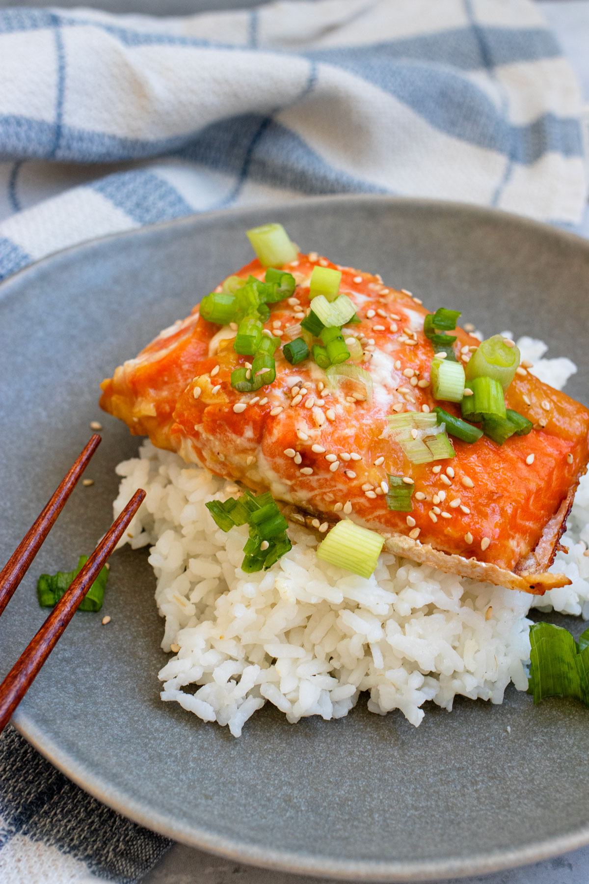 Baked honey miso salmon on a bed of cooked white rice.