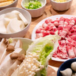 Hot pot ingredients on a table.