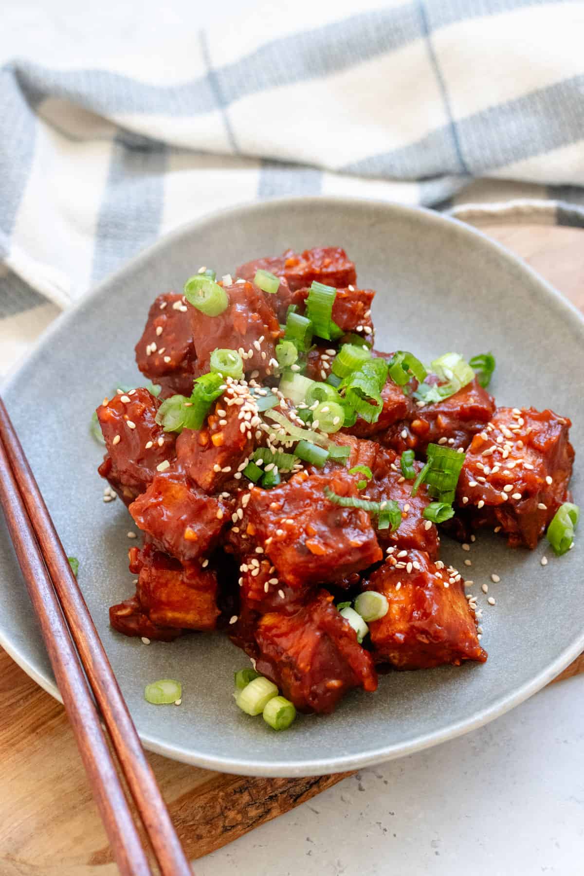 Gochujang baked tofu on a plate.