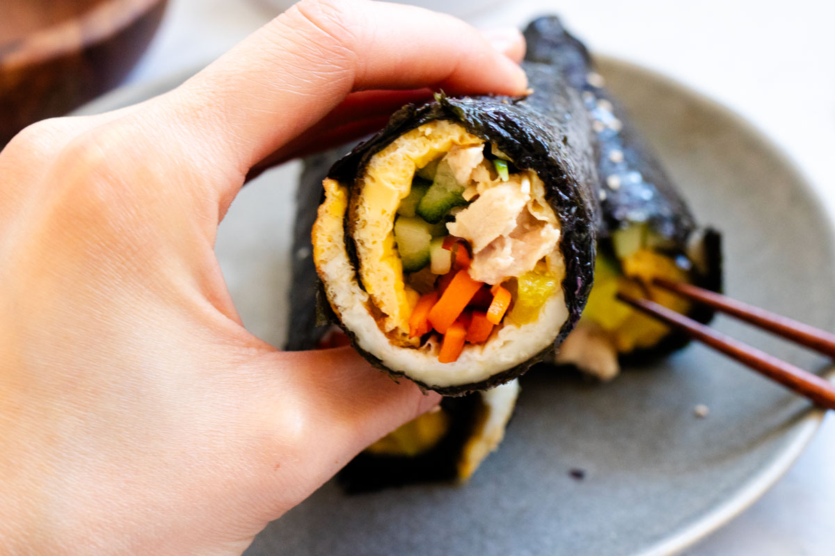 Protein kimbap with tuna, carrots, eggs, cucumber, and pickled daikon.