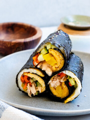 High protein low carb kimbap with egg, cucumber, carrot, tuna, and pickled daikon.